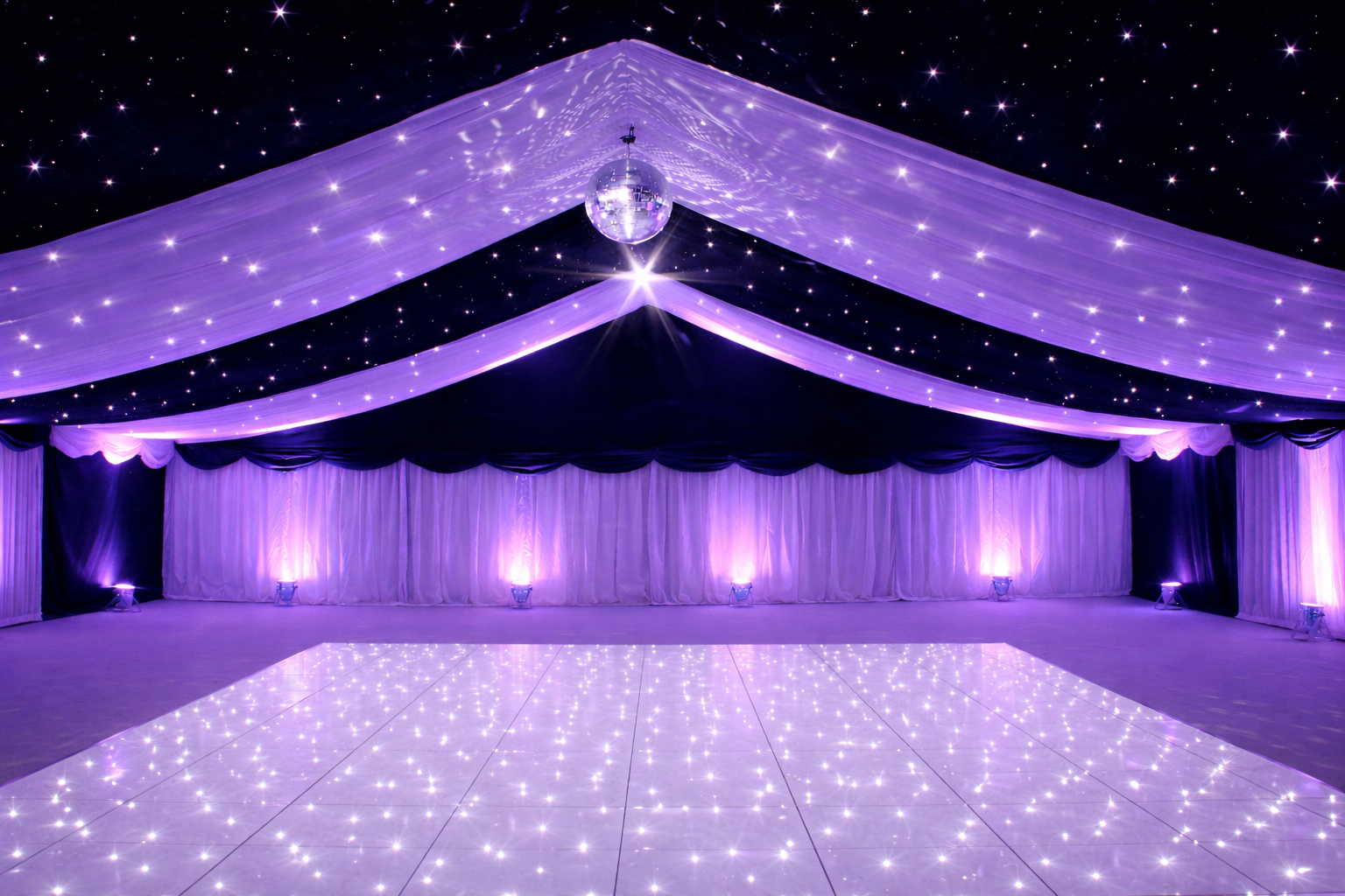 Coloured uplighting at an event venue