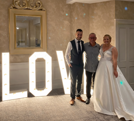 Wedding joy by the glowing letters